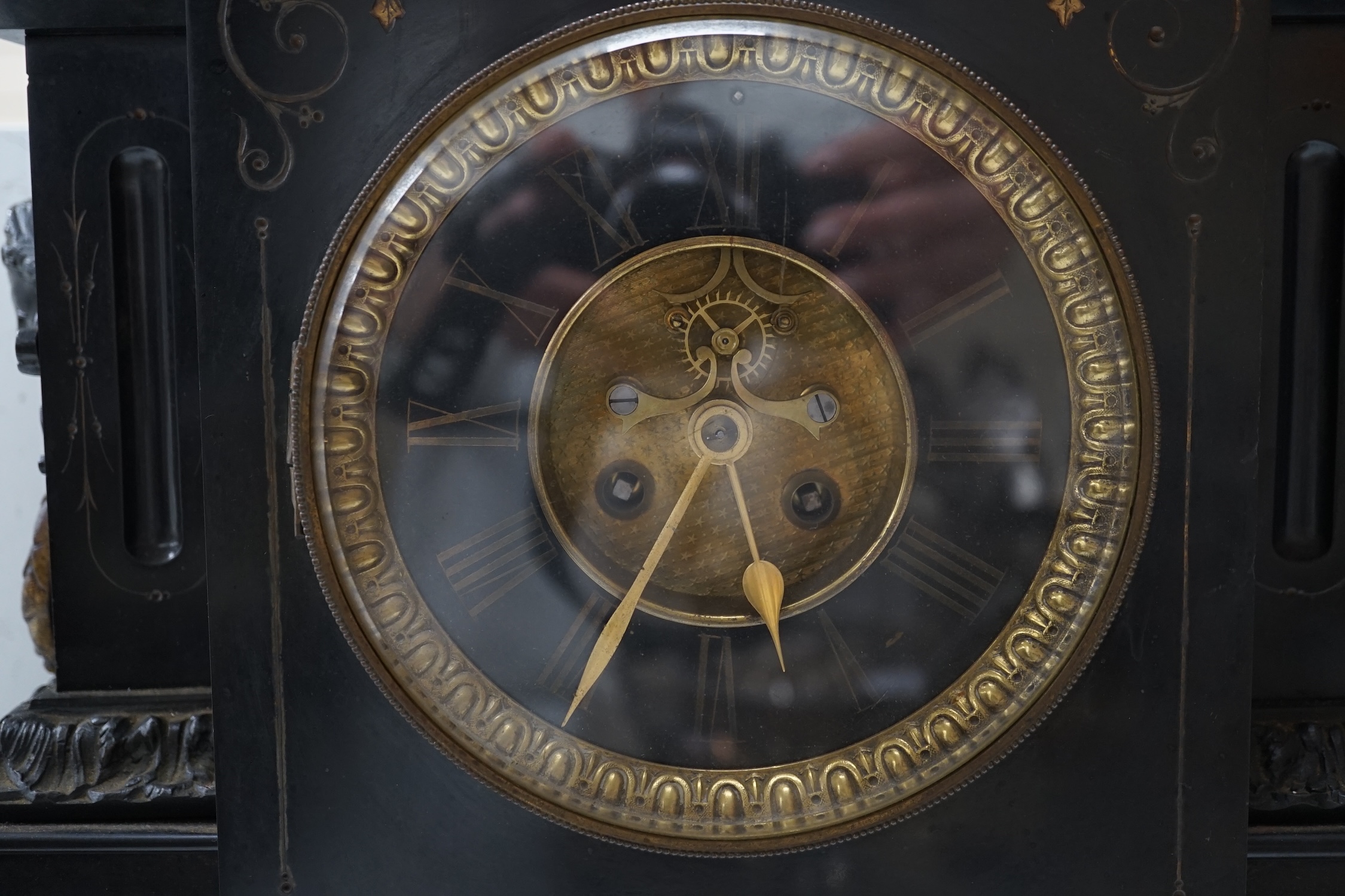 A large black slate mantel clock, with visible Brocot escapement, 45cm high